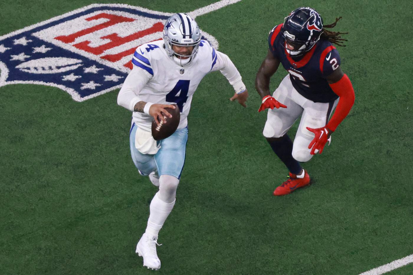 Dallas Cowboys quarterback Dak Prescott (4) runs the ball up the field as Houston Texans...
