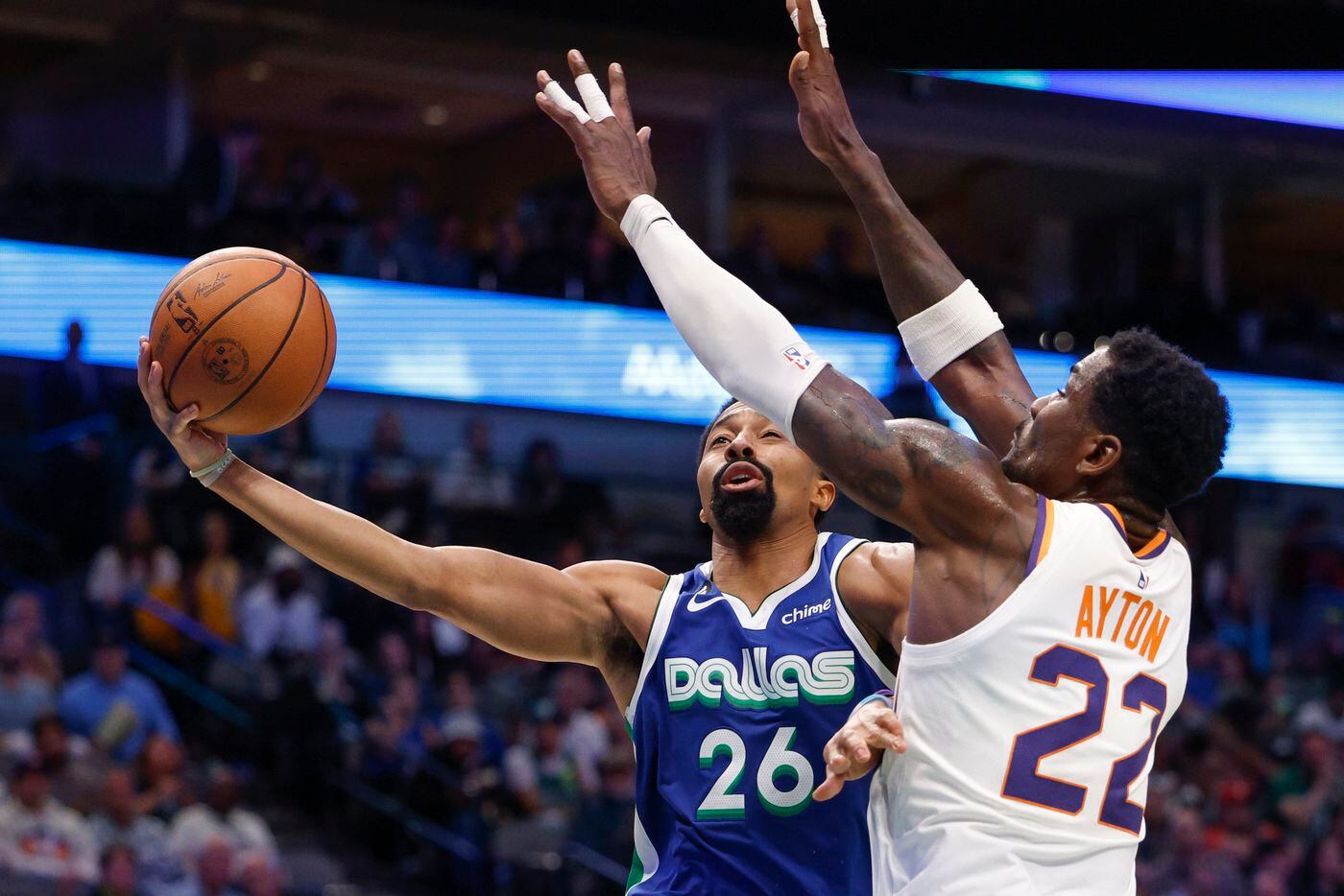 Dallas Mavericks guard Spencer Dinwiddie (26) drives to the basket against Phoenix Suns...