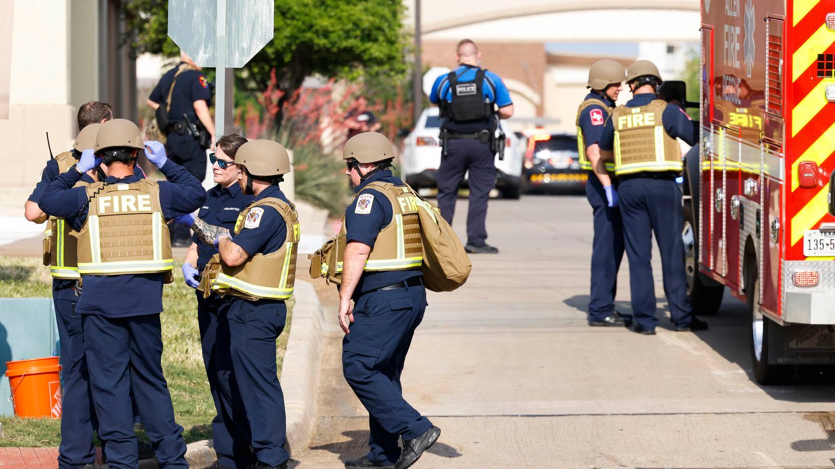 Law enforce authorities gather outside of the Allen Premium Outlets mall after a shooting...