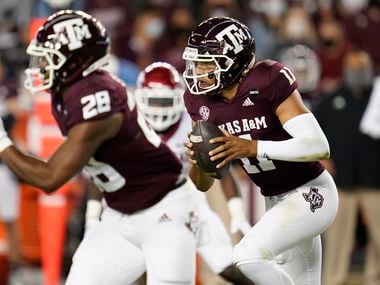 Texas A&M quarterback Kellen Mond (11) rushes against Arkansas during the first quarter of an NCAA college football game Saturday, Oct. 31, 2020, in College Station, Texas. (