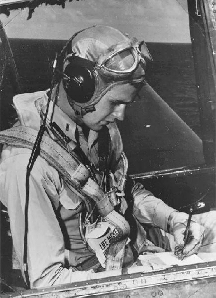 Navy pilot George H.W. Bush sits in the cockpit of an Avenger fighter aircraft, c. 1943-45. 