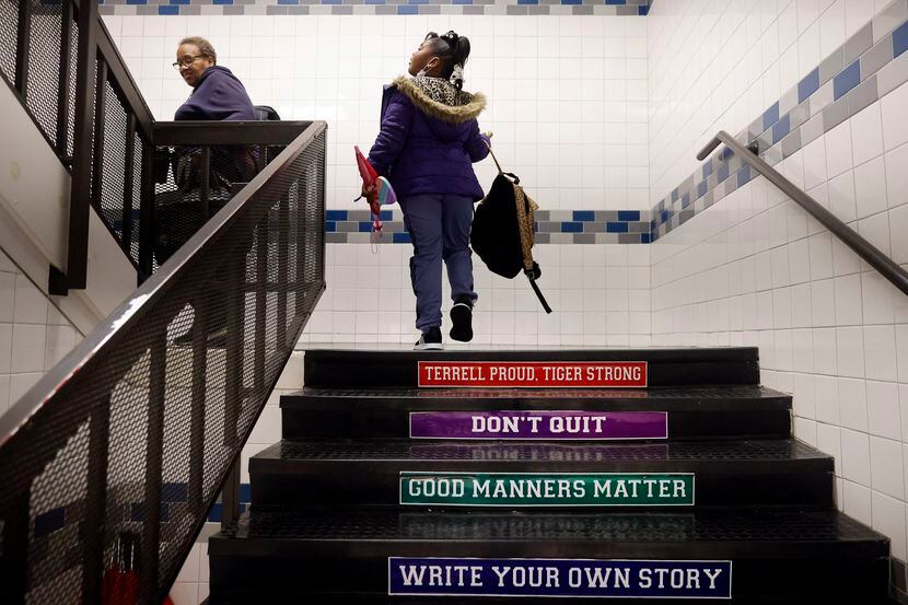 The stairs at Gilbert Willie Sr. Elementary school in Terrell ISD are marked with advice...