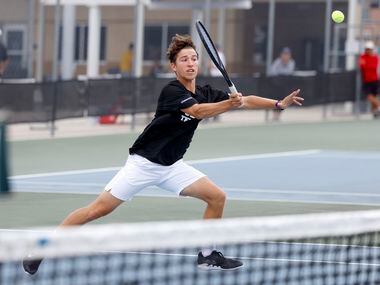 Plano West’s Ethan Scribner hits a volley during the 6A boys doubles championship match at...
