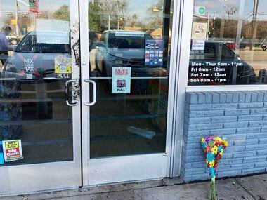 Flower stand at the Texaco station where three teenagers died after a shooting inside...