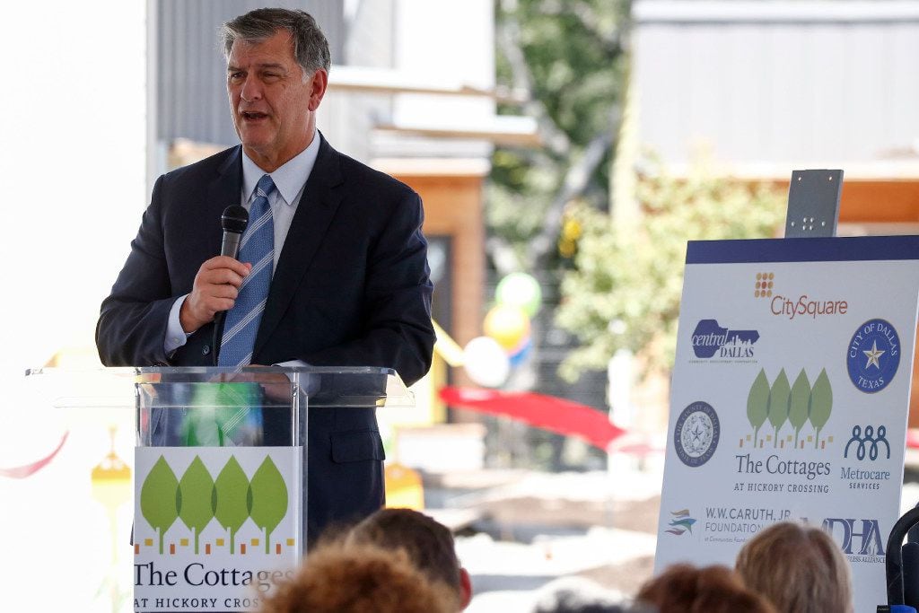 Dallas Mayor Mike Rawlings spoke on stage during the opening ceremony at Cottages at Hickory...