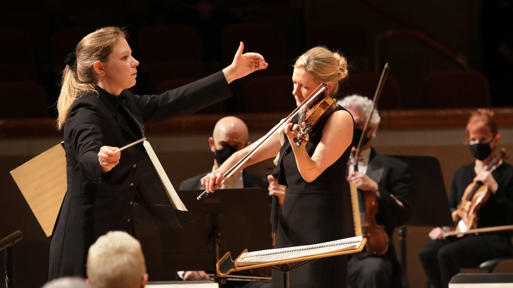 Principal guest conductor Gemma New (left) and violin soloist Angela Fuller Heyde perform...