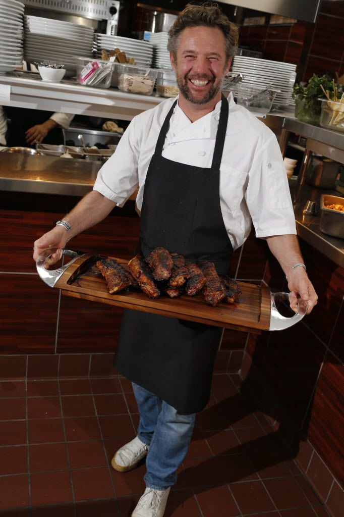 Chef Nick Badovinus with wood-fired meats in 2015