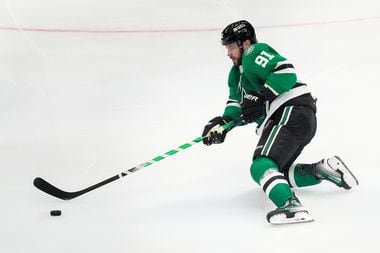 Dallas Stars center Tyler Seguin (91) clears the puck from the Star zone during the third...