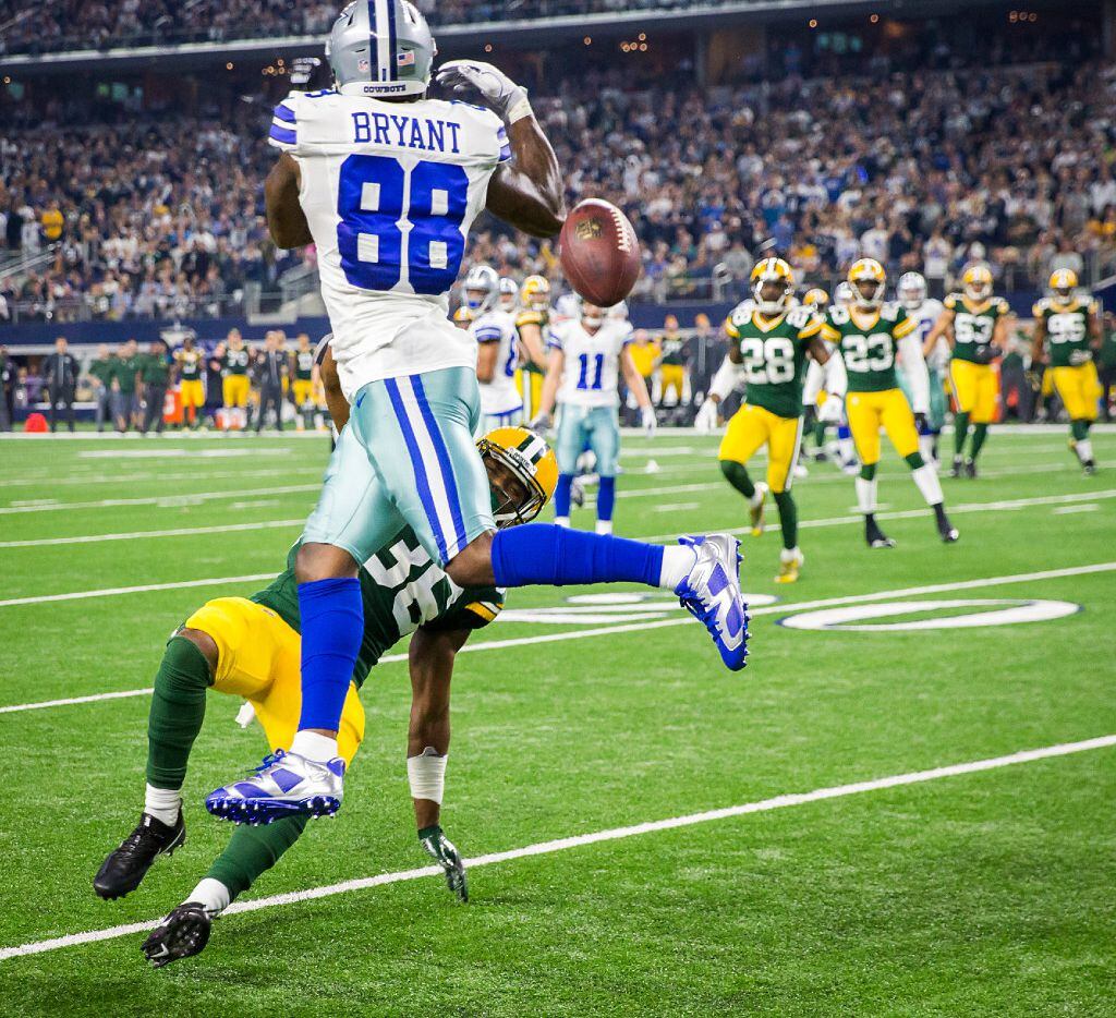 Dallas Cowboys wide receiver Dez Bryant (88) can't catch a pass as Green Bay Packers...