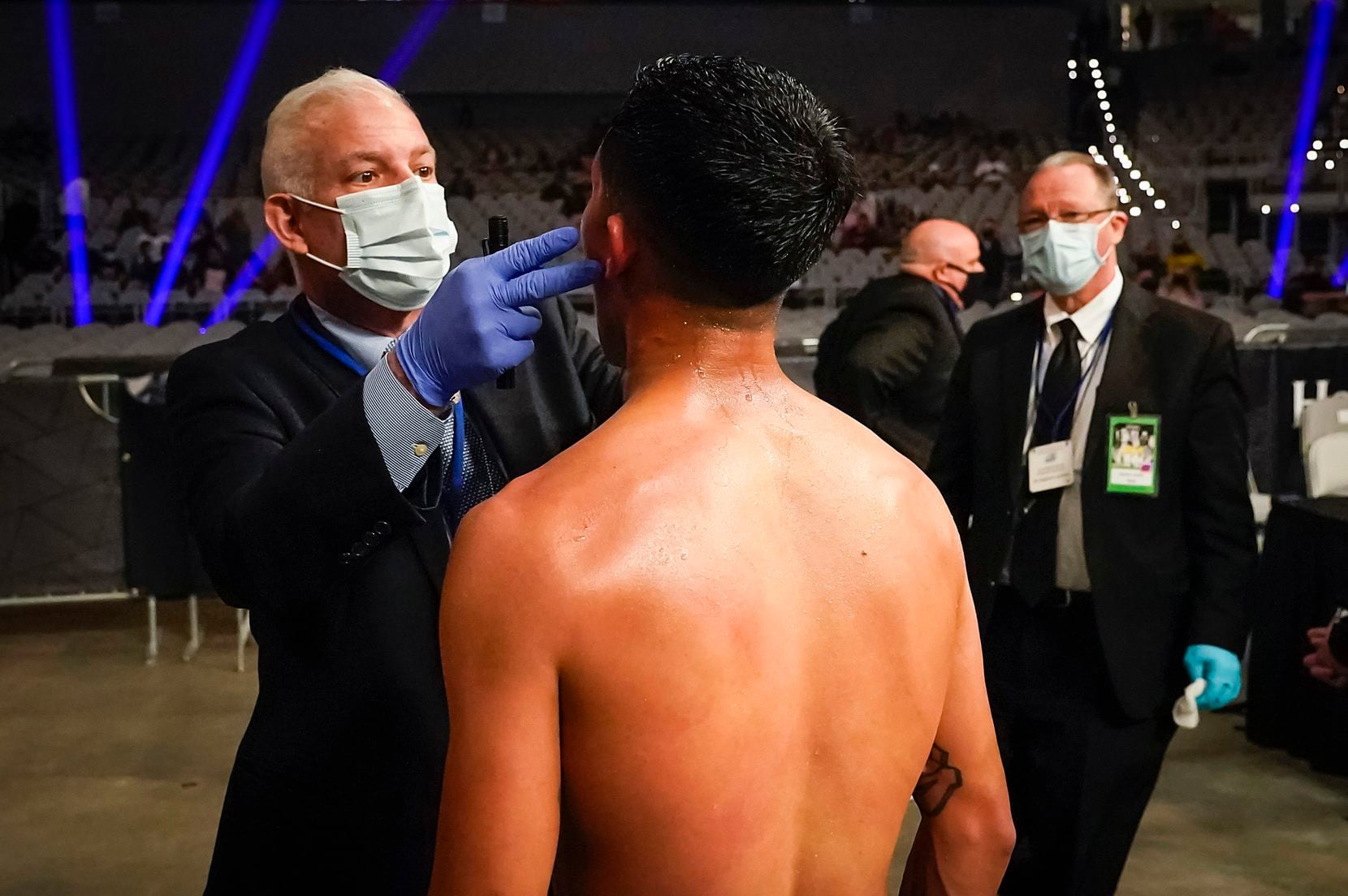 Doctor Scott Lauer checks on  Hector Valdez after he defeated Alberto Torres in a super bantamweight bout at Dickies Arena on Saturday, March 20, 2021, in Fort Worth.