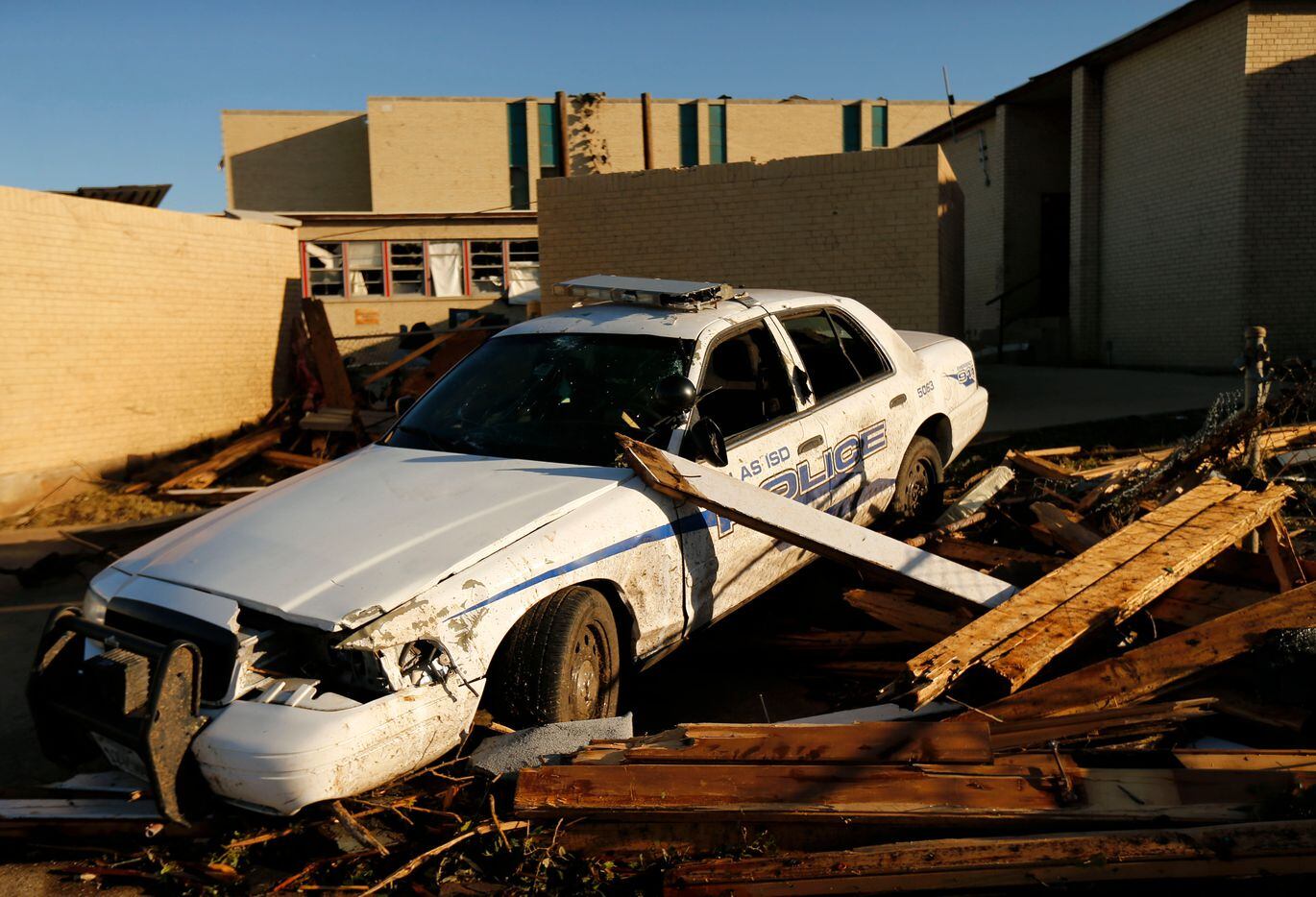 A Dallas ISD school district police patrol car was destroyed by a tornado at Cary Jr. High School in Dallas, Monday, October 21, 2019.