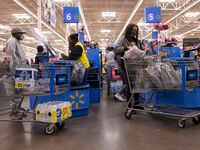 Shoppers check out at a Walmart in Dallas ahead of a winter storm in 2021. Experts say...