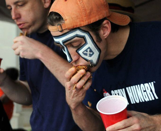 Professional eater Tim "Eater X" Janus competes in the World Tamale Eating Championship held...