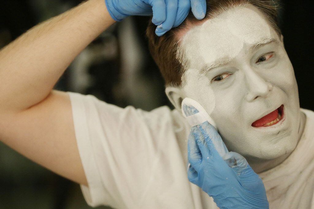 Ben Bryant, who plays Nigel Grouse, demonstrates the process of applying makeup and dressing...