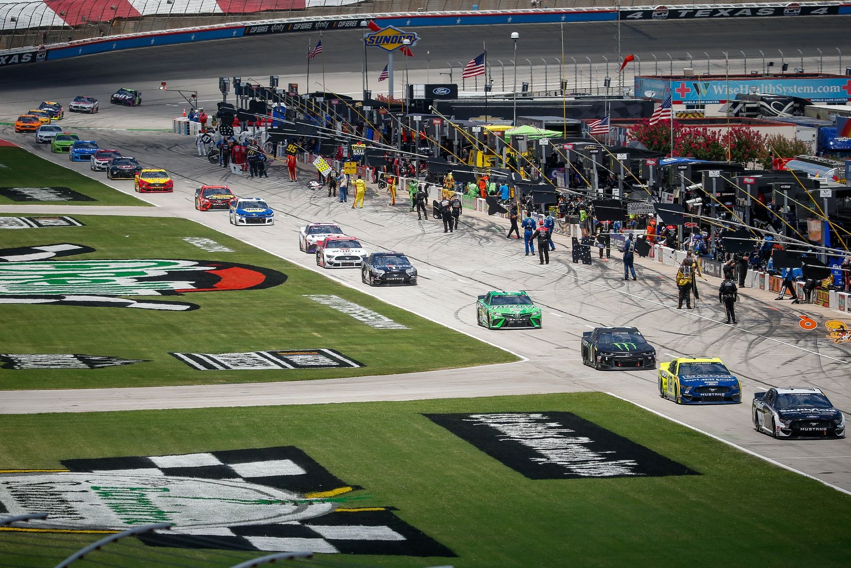 Drivers line up before the start of the NASCAR Cup Series O'Reilly Auto Parts 500 race on...
