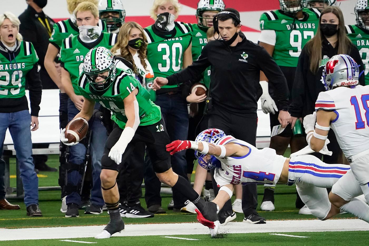 Southlake Carroll wide receiver Brady Boyd (14) is knocked out of bounds by Austin Westlake defensive back Michael Taaffe in front of Southlake Carroll head coach Riley Dodge during the first quarter of the Class 6A Division I state football championship game at AT&T Stadium on Saturday, Jan. 16, 2021, in Arlington, Texas. (Smiley N. Pool/The Dallas Morning News)