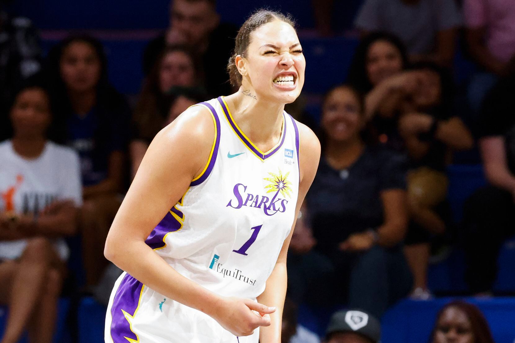 Los Angeles Sparks center Liz Cambage reacts after a foul during the first half of a WNBA...
