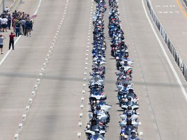 Police officers from all over the nation drive down US Hwy 75 during the funeral procession...