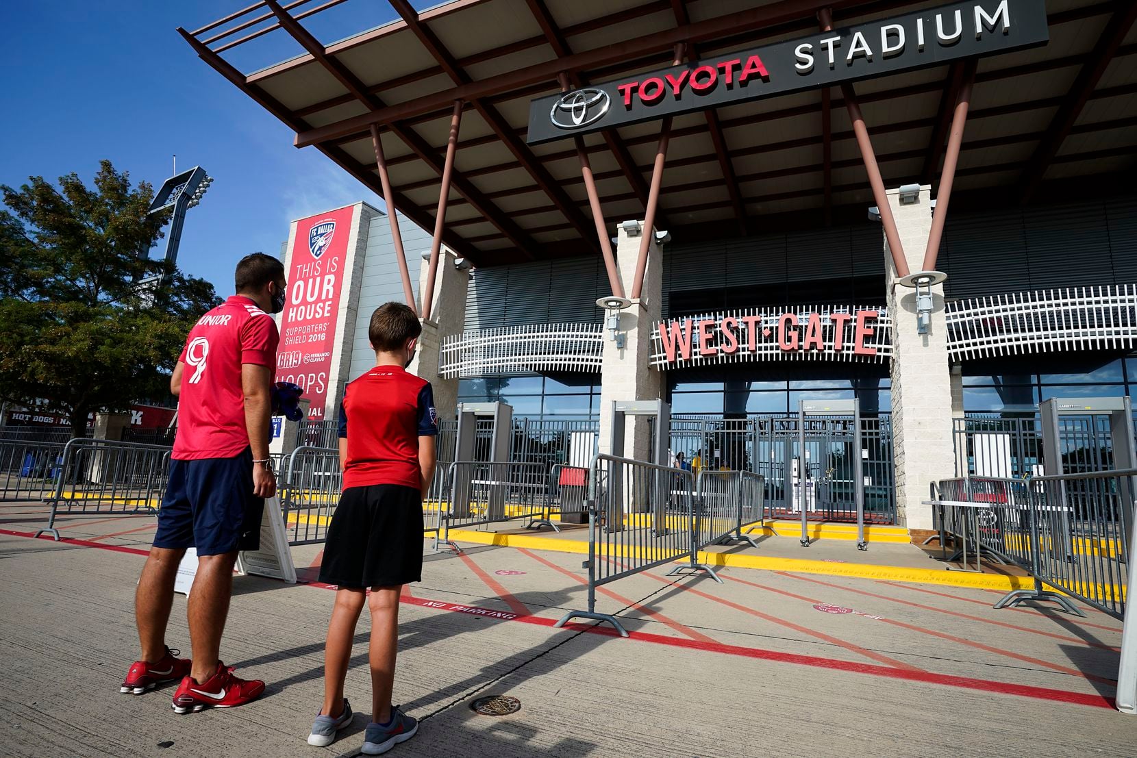 Jeff Files and his son Bentley. 9, are the first in line to enter the West Gate before an MLS soccer game at Toyota Stadium on Wednesday, Aug. 12, 2020, in Frisco, Texas. (Smiley N. Pool/The Dallas Morning News)