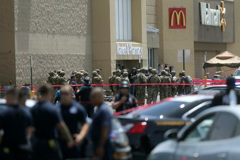 FILE - Several law enforcement agencies respond to an active shooter at a Walmart in El...