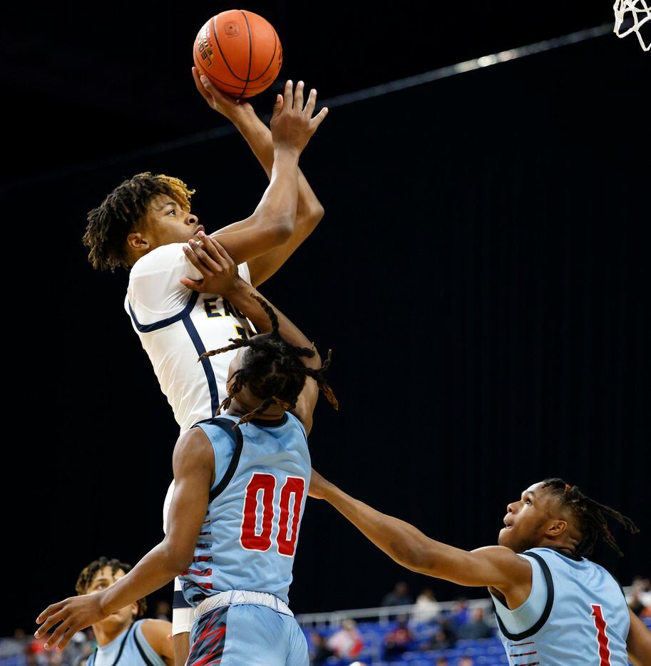 Oak Cliff Faith Family Academy forward JT Toppin (15) elevates for a shot attempt over...