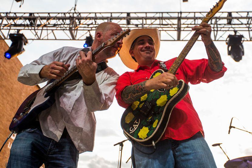 Chad Rueffer, left, and Matt Hillyer of Eleven Hundred Springs perform during the grand...