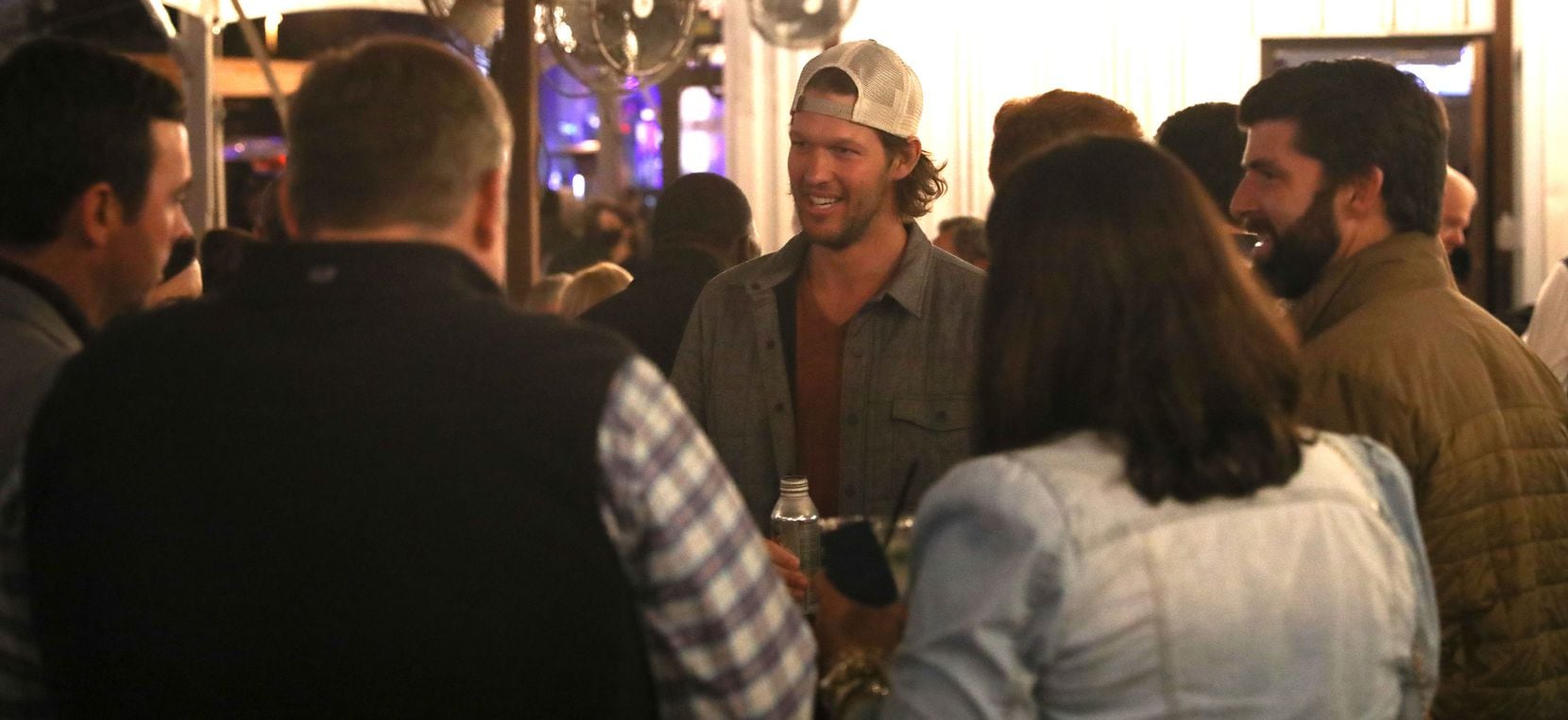 Clayton Kershaw speaks with guests at the November 11, 2021 fundraising event for nonprofit...