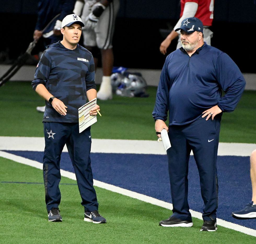 Dallas Cowboys offensive coordinator Kellen Moore, left, and head coach Mike McCarthy talk...