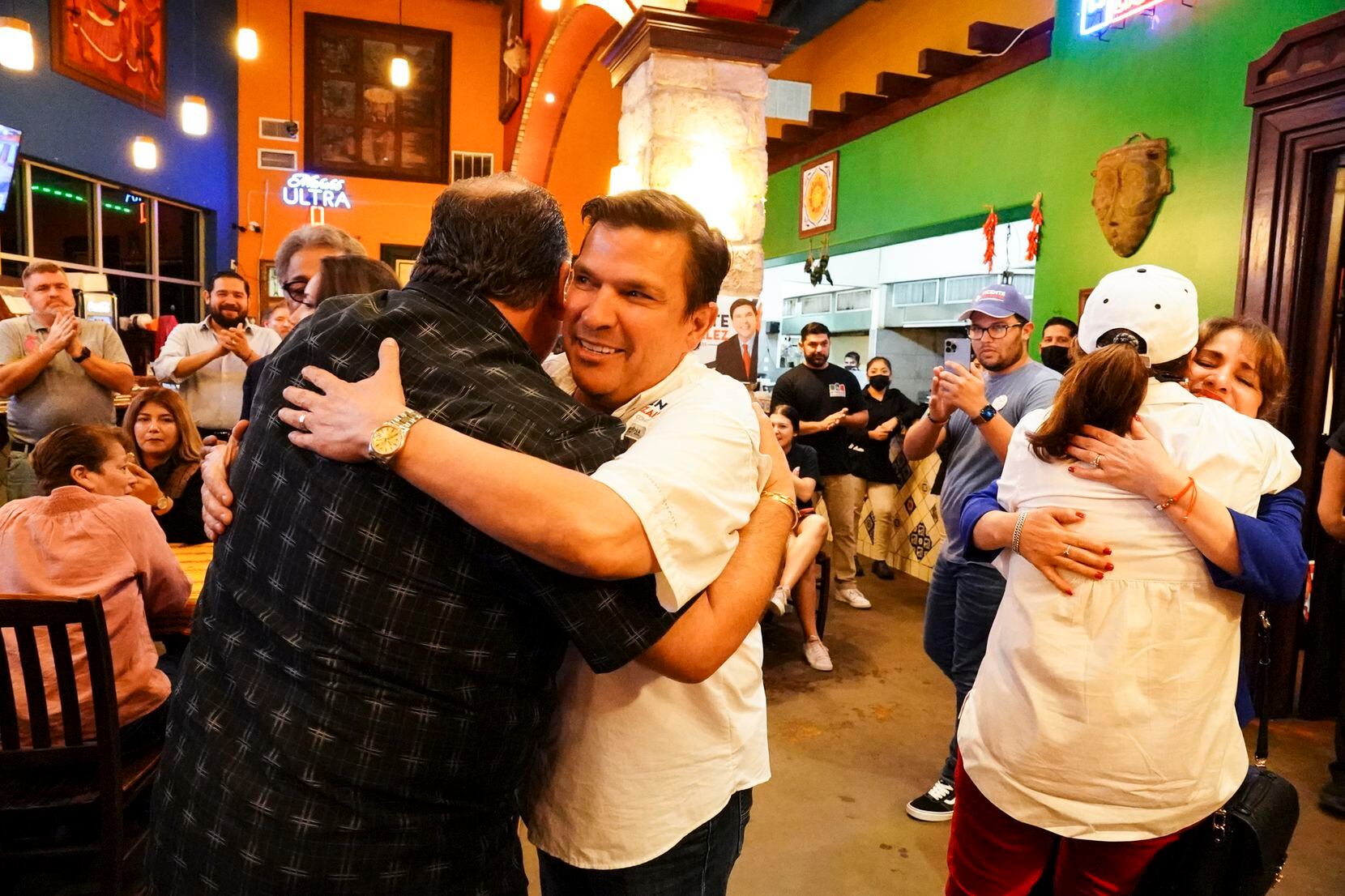 Rep. Vicente Gonzalez hugs a supporter at an Election Night watch party on Nov. 8, 2022, in...