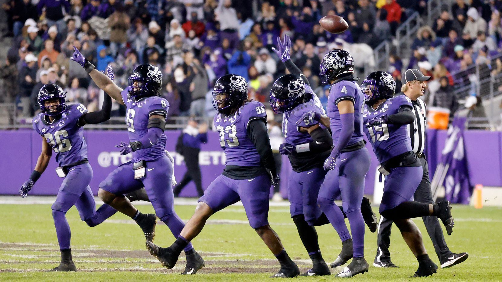 The TCU Horned Frogs defense celebrates a third quarter fumble recovery against the Iowa...