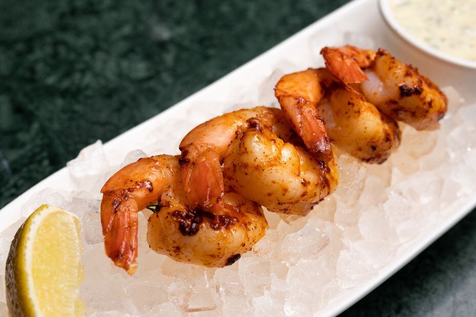 Grilled jumbo shrimp comes with a side of Green Point tartar sauce. Why the name? Green...
