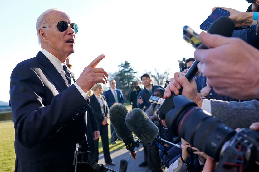 President Joe Biden talks with reporters on the South Lawn of the White House in Washington,...