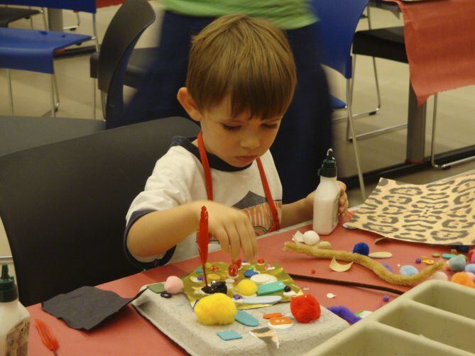 A child makes art at a summer camp hosted by the Dallas Museum of Art. The Irving Arts...