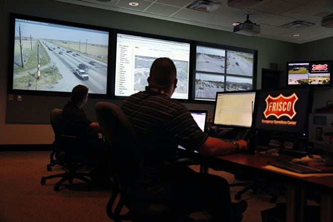 Officials monitor traffic camera activity while manning the Frisco Fire Department's...