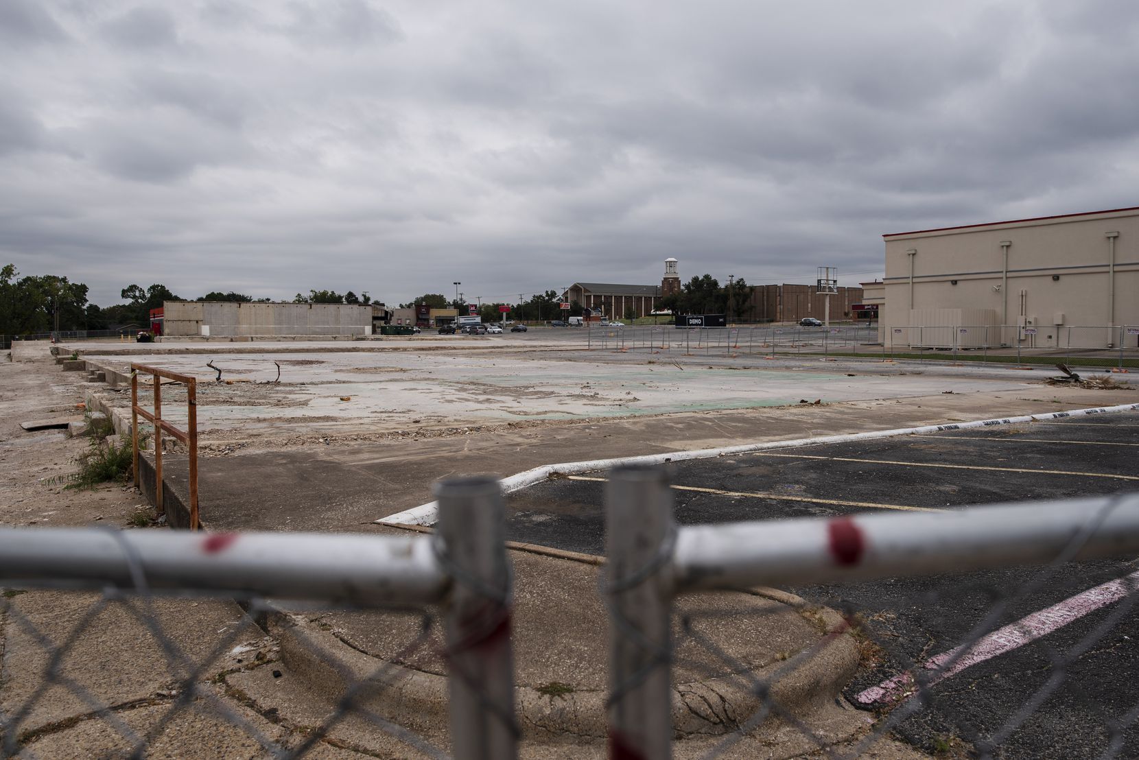 Buildings that housed Little Caesar's and other businesses and were destroyed by last October's tornadoes have been torn down at the Marsh Lane Plaza shopping center. 