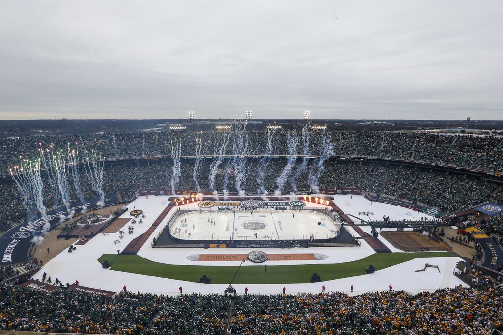 Pyrotechnics go off prior to the first period of a NHL Winter Classic matchup between the...
