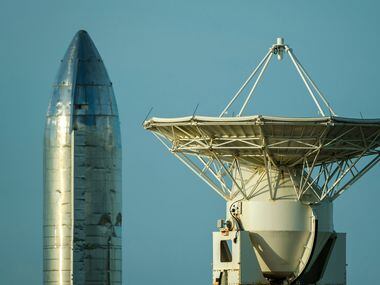 A prototype of the Starship spacecraft is seen with a tracking antenna at the SpaceX Space...