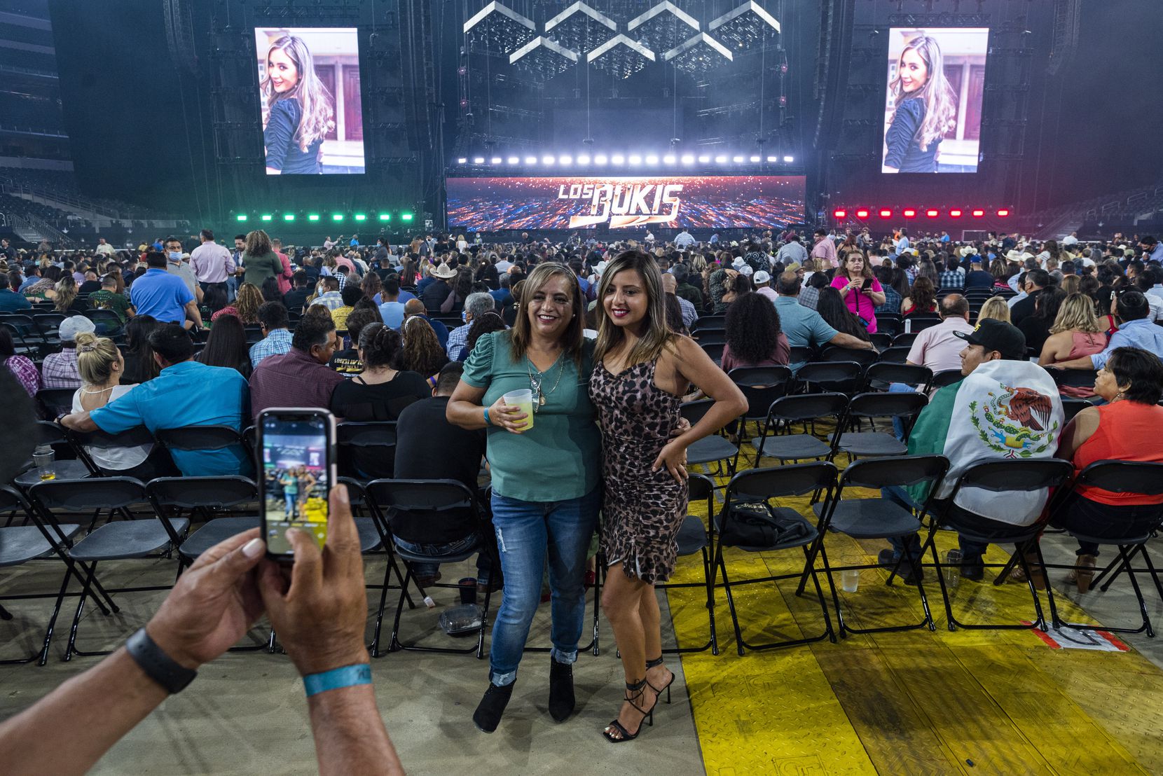 Fans pose for a photo at the concert. Some traveled more than 1,000 miles to relive memories...