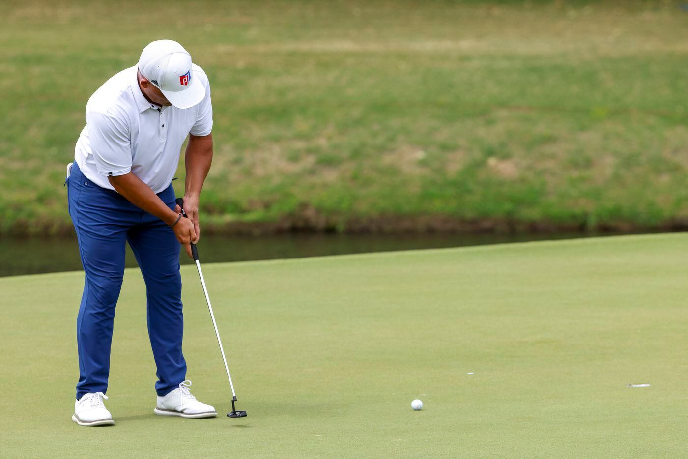 MLB Hall of Fame catcher Ivan "Pudge" Rodriguez putts for a birdie on the 17th green during...