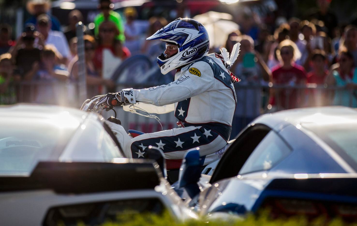 Daredevil Robbie Knievel prepares to jump over 18 Corvettes during a celebration and...