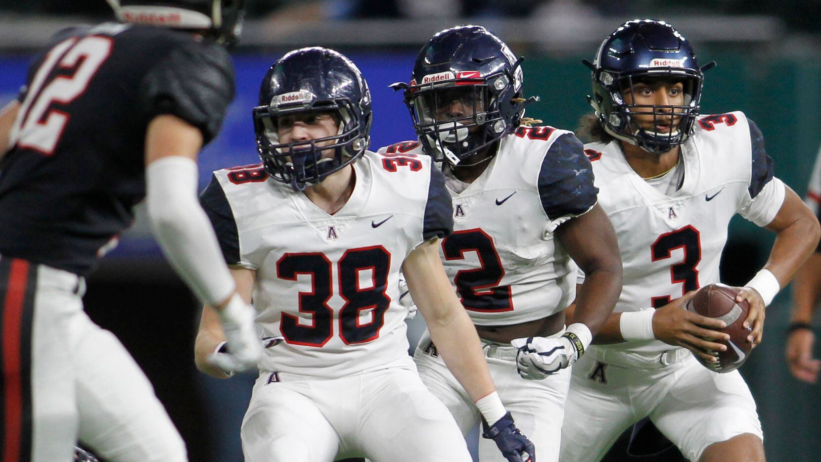 Allen quarterback Mike Hawkins (3), right, rolls out behind the protection of Eagles running...