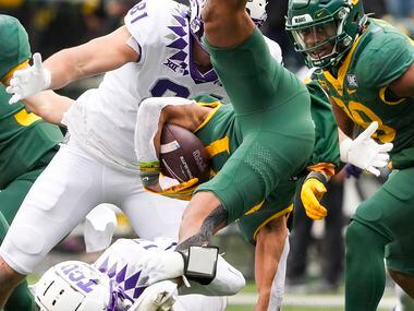Baylor wide receiver Monaray Baldwin (80) is upended by TCU safety Deshawn McCuin (17) on a ...