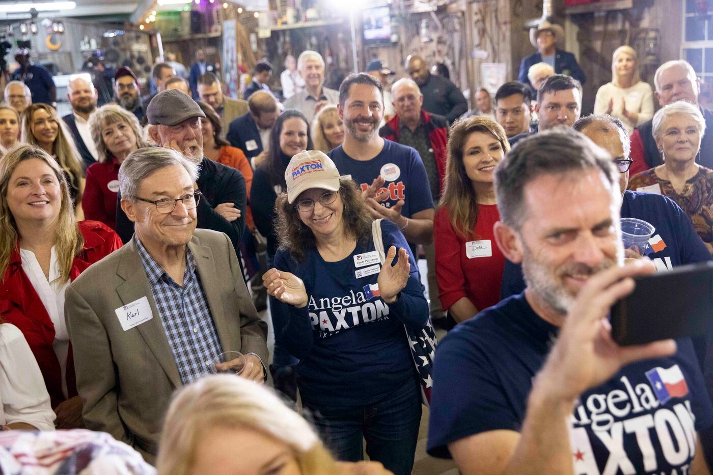 People clap as they listen to Attorney General Ken Paxton speak during a Collin County GOP...