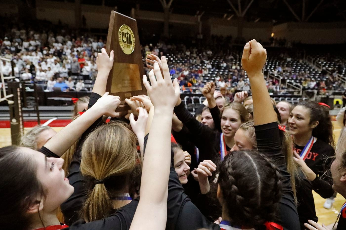 Lovejoy High School hoists up the state championship trophy after winning the match as...
