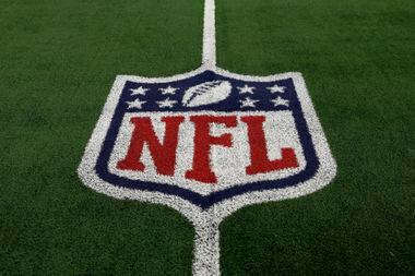 The NFL shield logo on the field before an NFL football game between the Detroit Lions and...