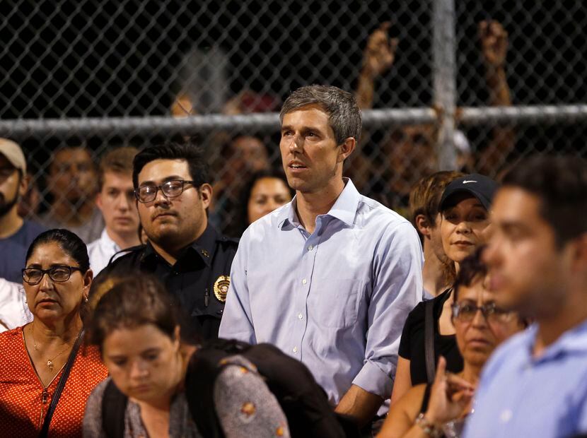 Democratic presidential candidate Beto O'Rourke listened during a vigil at Ponder park in El...
