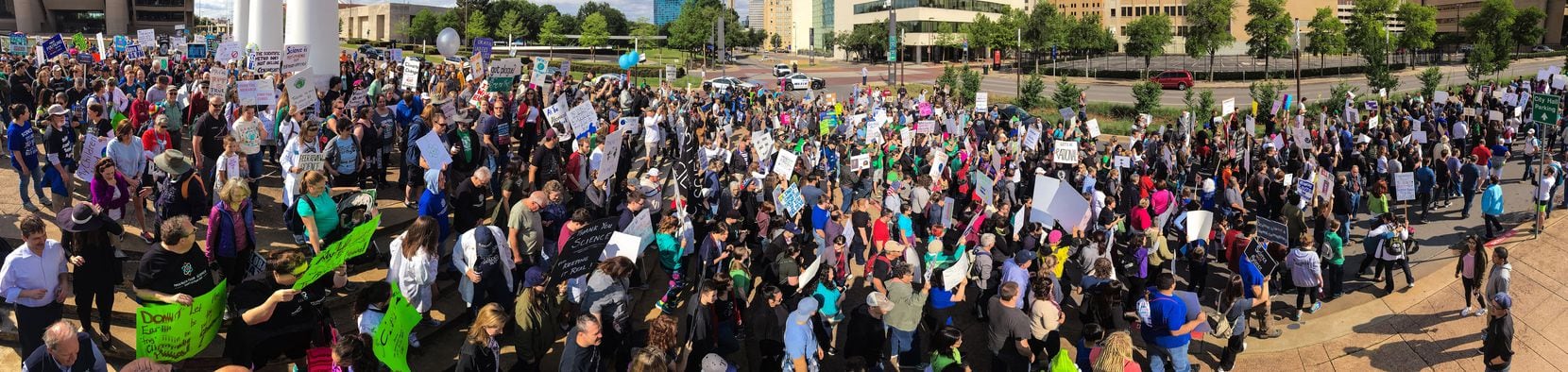 As seen in this panoramic image, the March For Science rally kicked off at Dallas City Hall...