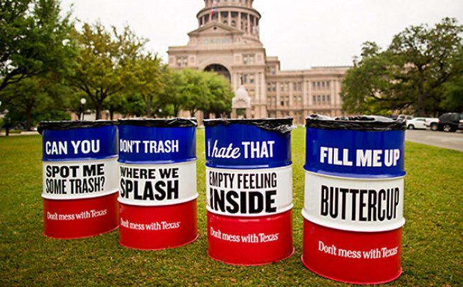 Colorful barrels emblazoned with catchy slogans outside the Texas Capitol.