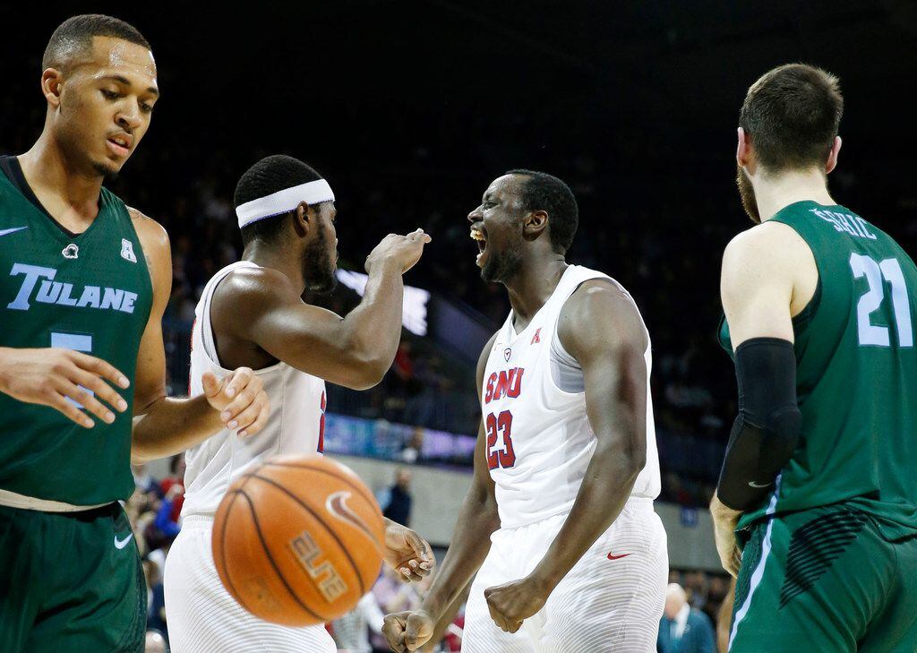 SMU Mustangs forward Akoy Agau (23) celebrates after making a basket and getting fouled by...