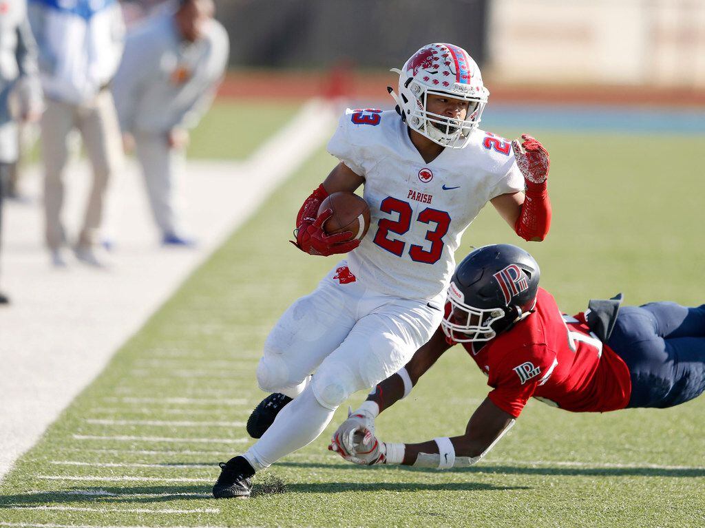 Parish Episcopal's Christian Benson (23) breaks away from  Plano John Paul II's Terrance Brooks (26) on a play during the second half of play at the TAPPS Division I State Championship game at Waco Midway's Panther Stadium in Hewitt, Texas on Friday, December 6, 2019. Parish Episcopal defeated Plano John Paul II 42-14 to win the championship game. (Vernon Bryant/The Dallas Morning News)